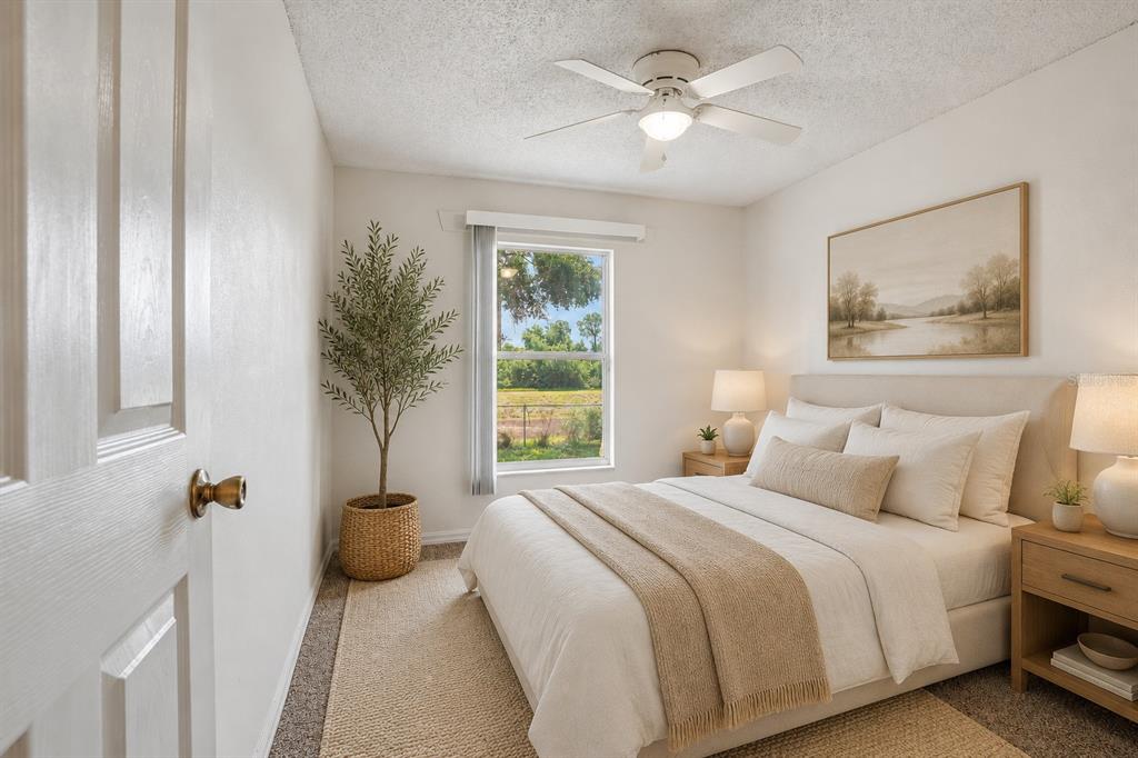 2596 Alclobe Circle Ocoee, FL 34761 - Photo 47 of 70 a bedroom with a bed and a painting on the wall