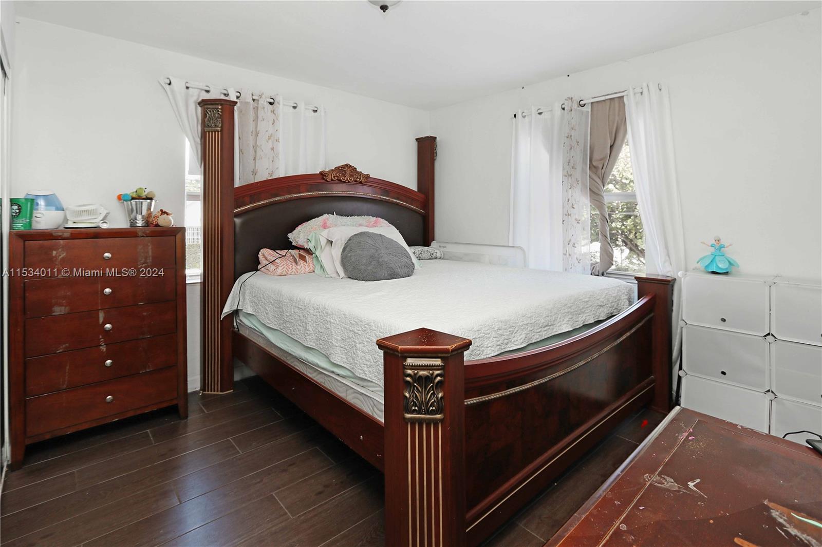 1810 Northwest 34th Street Miami, FL 33142 - Photo 11 of 33 a bedroom with a bed and a dresser