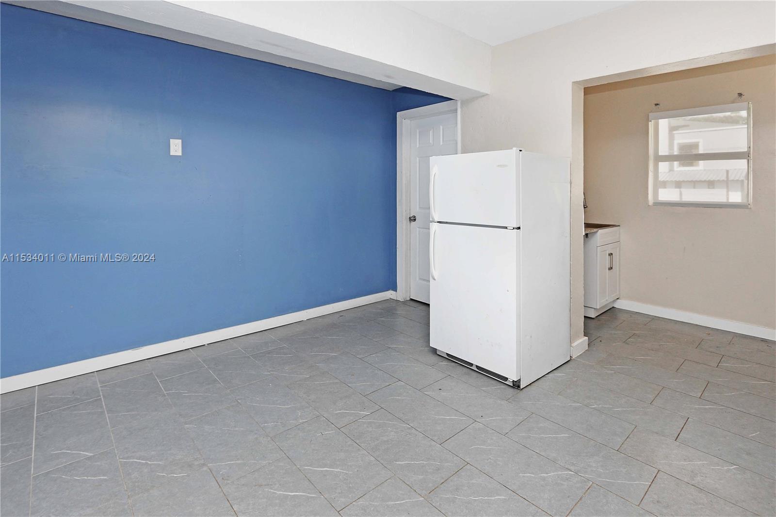 1810 Northwest 34th Street Miami, FL 33142 - Photo 12 of 33 an empty room with windows