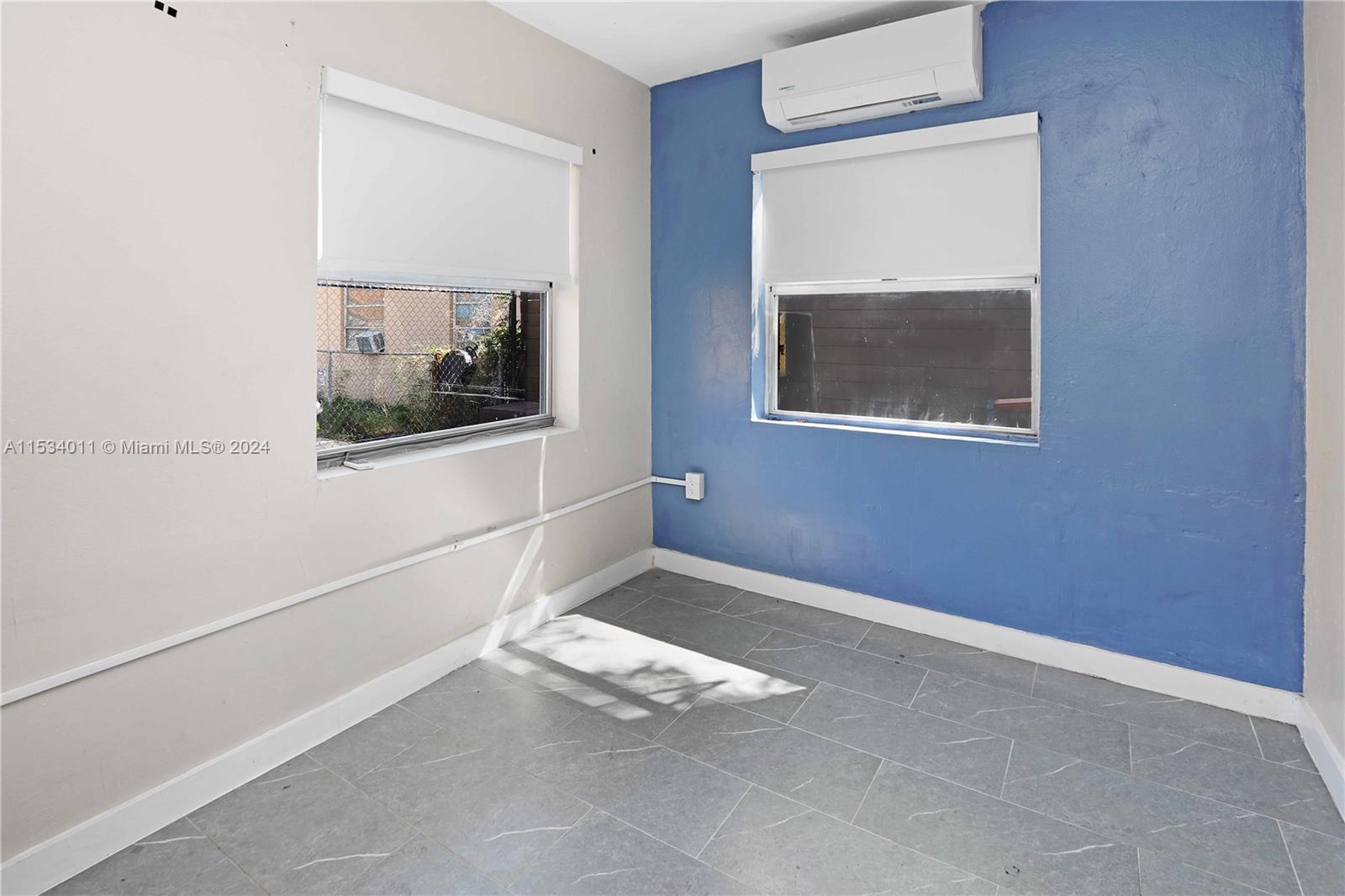 1810 Northwest 34th Street Miami, FL 33142 - Photo 14 of 33 a view of livingroom with window