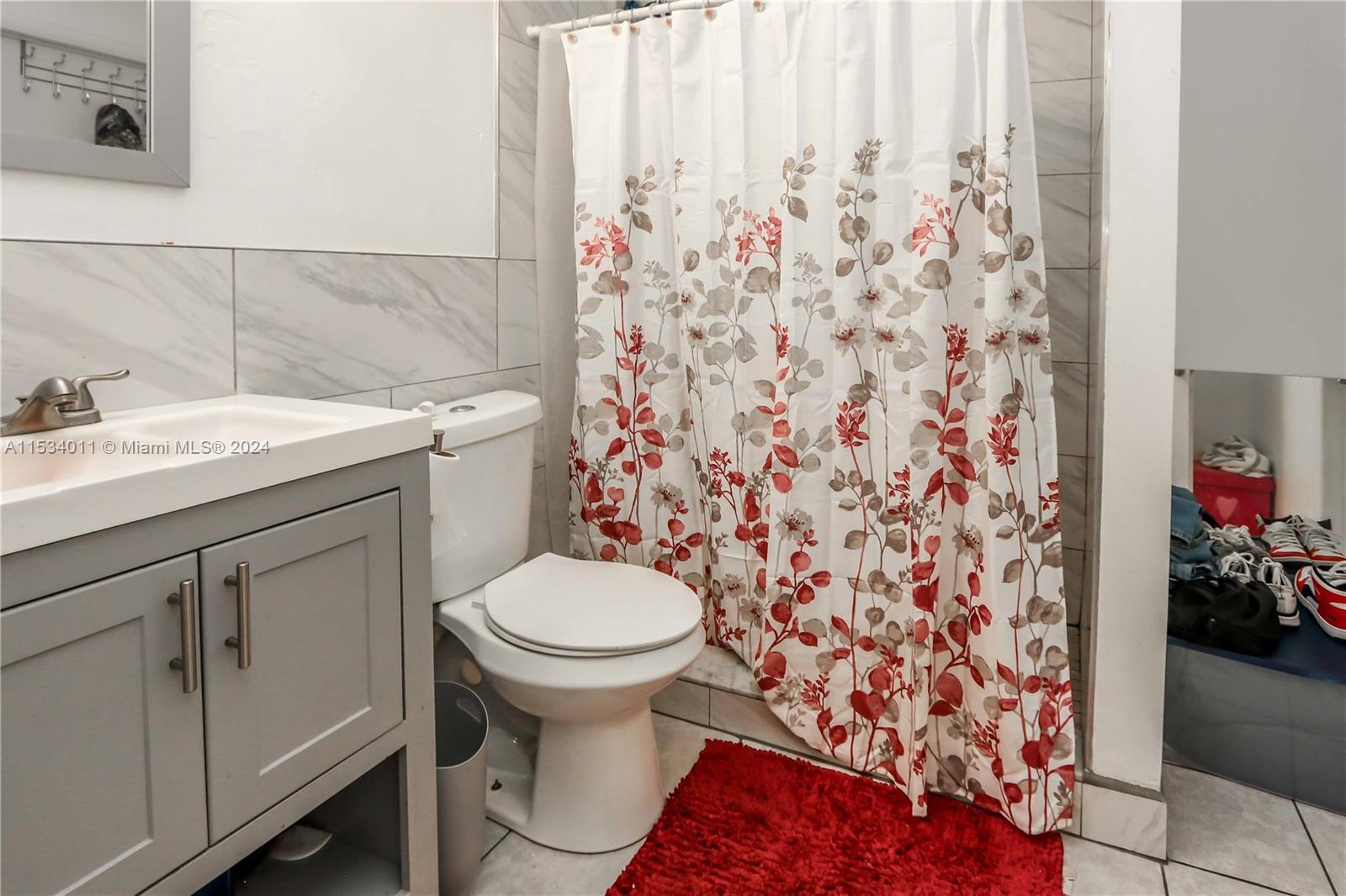 1810 Northwest 34th Street Miami, FL 33142 - Photo 20 of 33 a bathroom with a sink toilet and shower