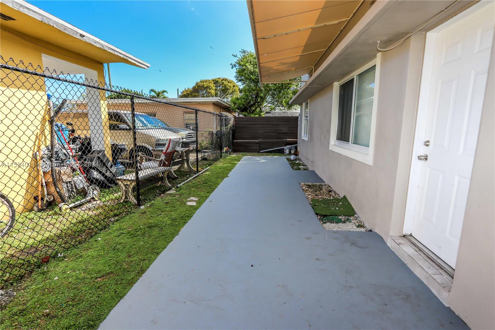 1810 Northwest 34th Street Miami, FL 33142 - Photo 24 of 33 a view of a house with backyard and sitting area
