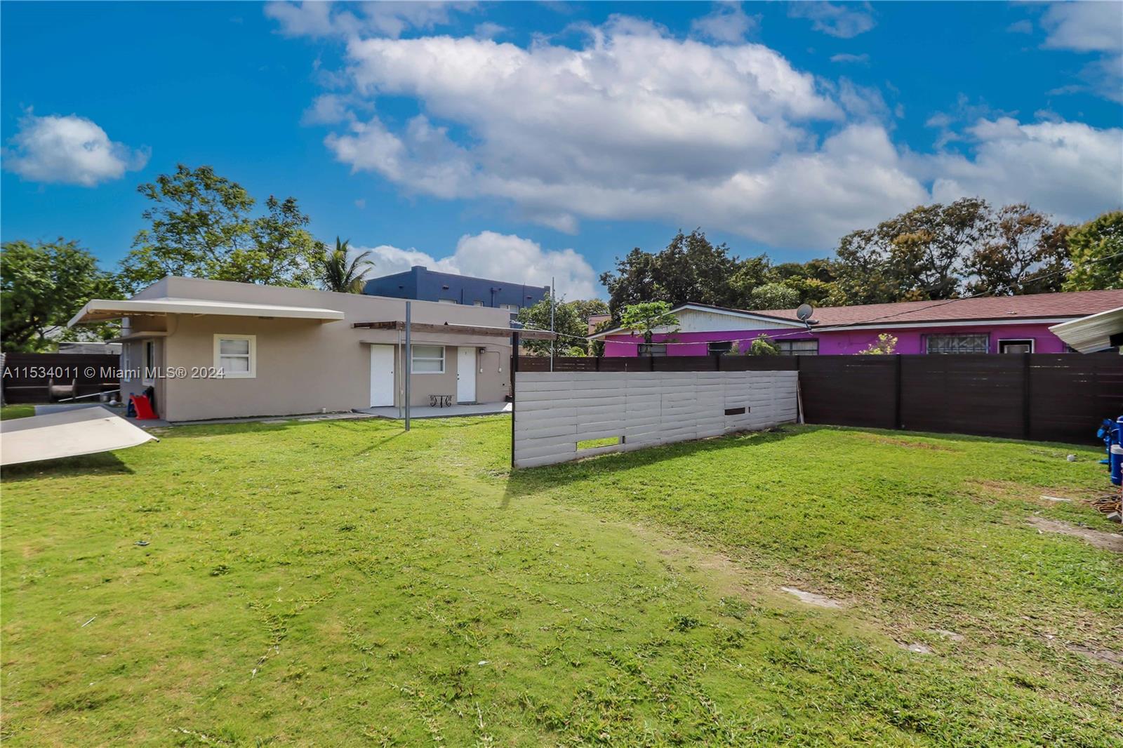 1810 Northwest 34th Street Miami, FL 33142 - Photo 26 of 33 a view of a house with a backyard