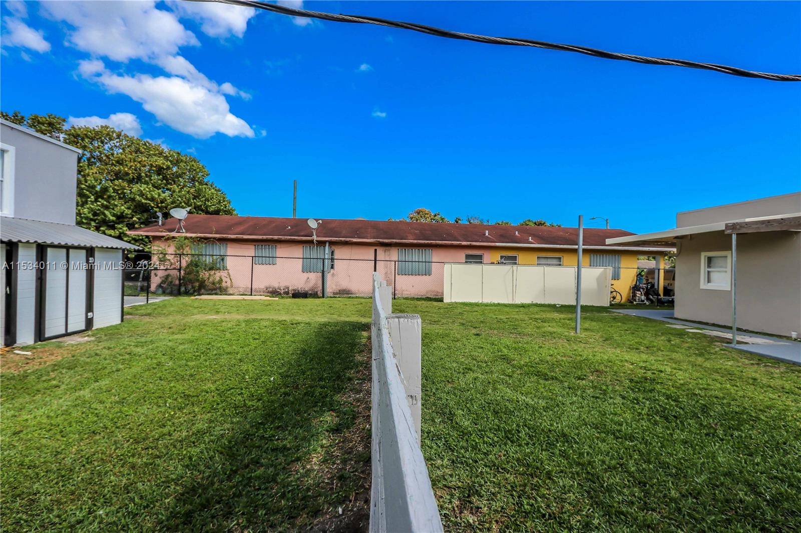 1810 Northwest 34th Street Miami, FL 33142 - Photo 28 of 33 a view of a house with a yard