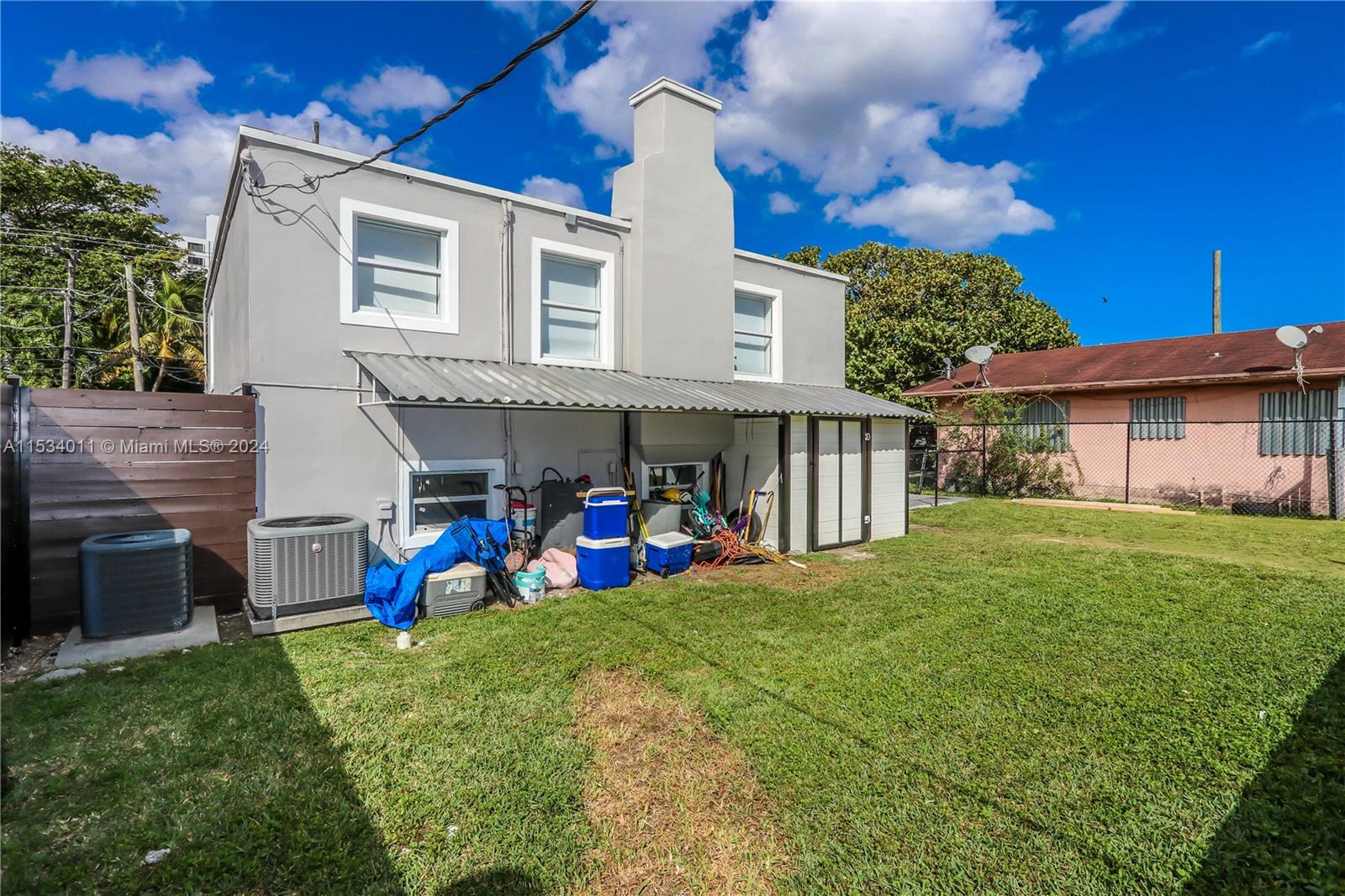 1810 Northwest 34th Street Miami, FL 33142 - Photo 29 of 33 a view of a house with a yard and sitting area