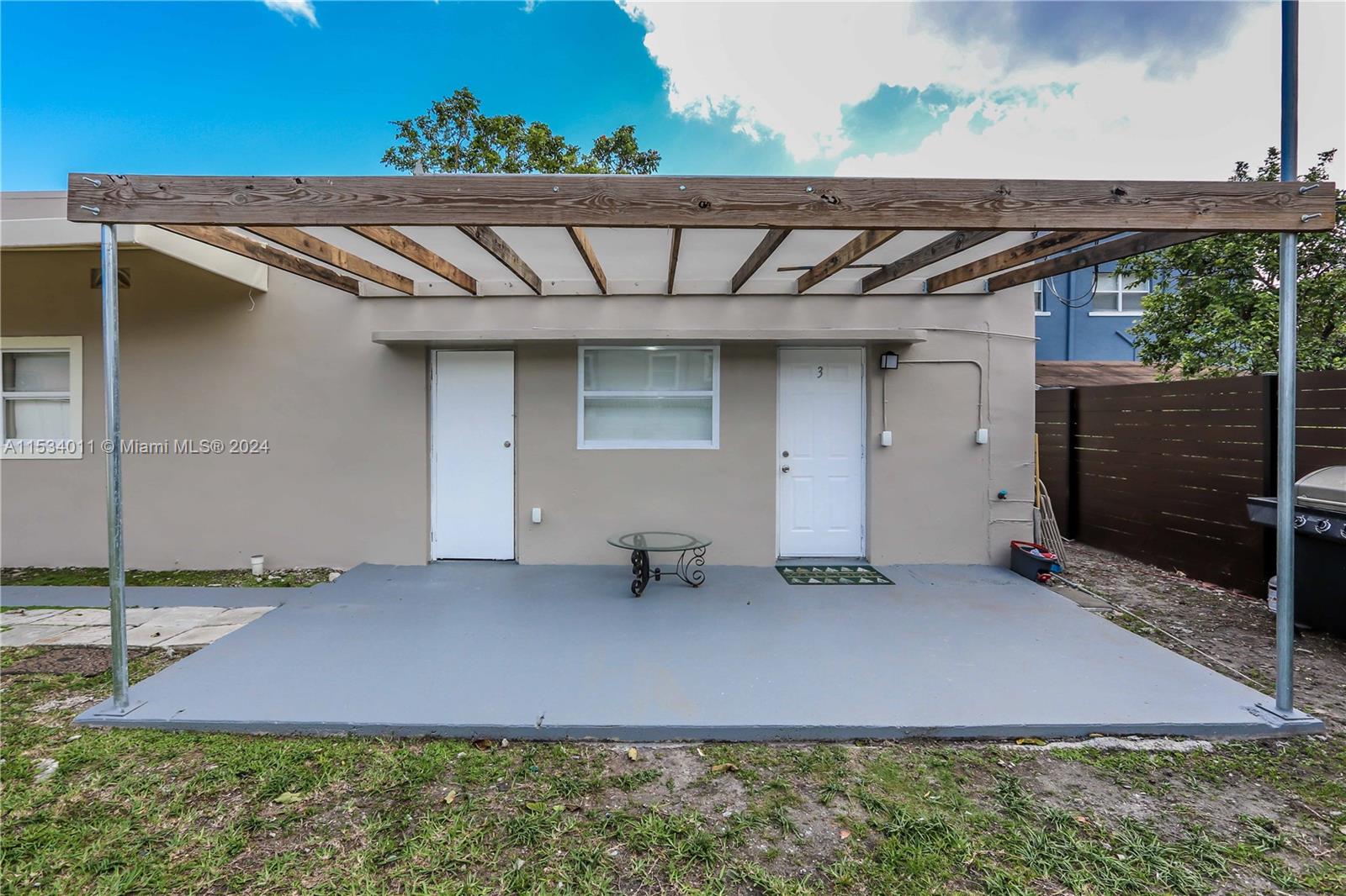 1810 Northwest 34th Street Miami, FL 33142 - Photo 33 of 33 a front view of a house with a yard