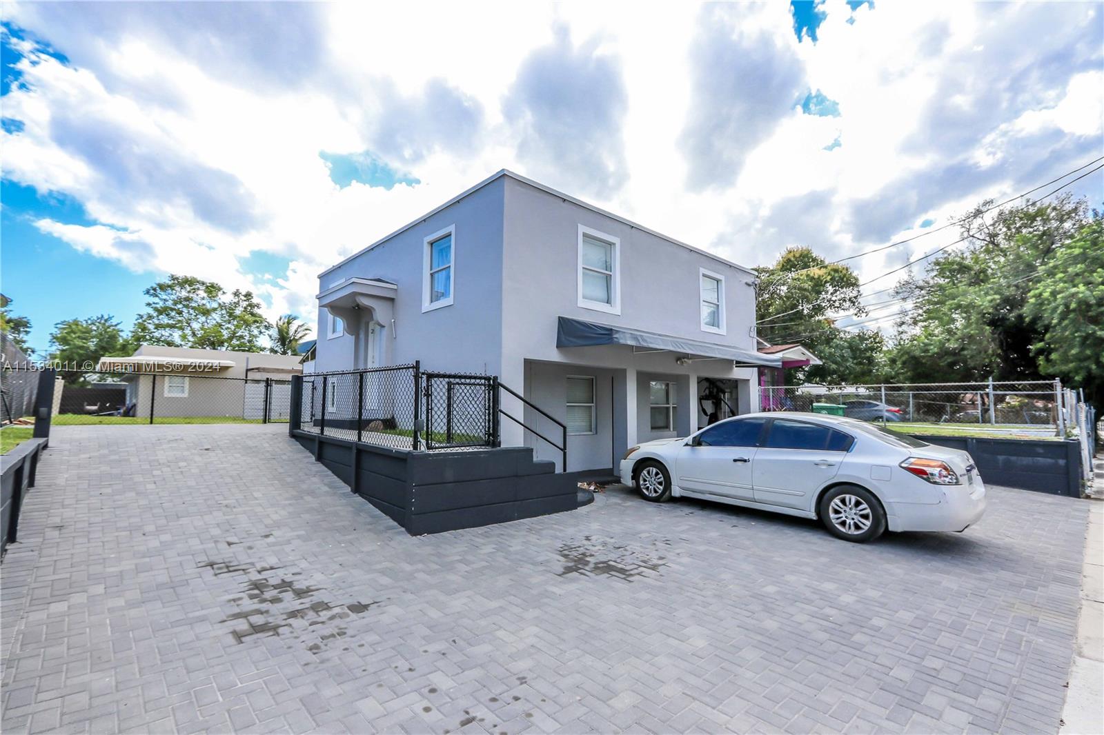 1810 Northwest 34th Street Miami, FL 33142 - Photo 7 of 33 a front view of a house with parking space