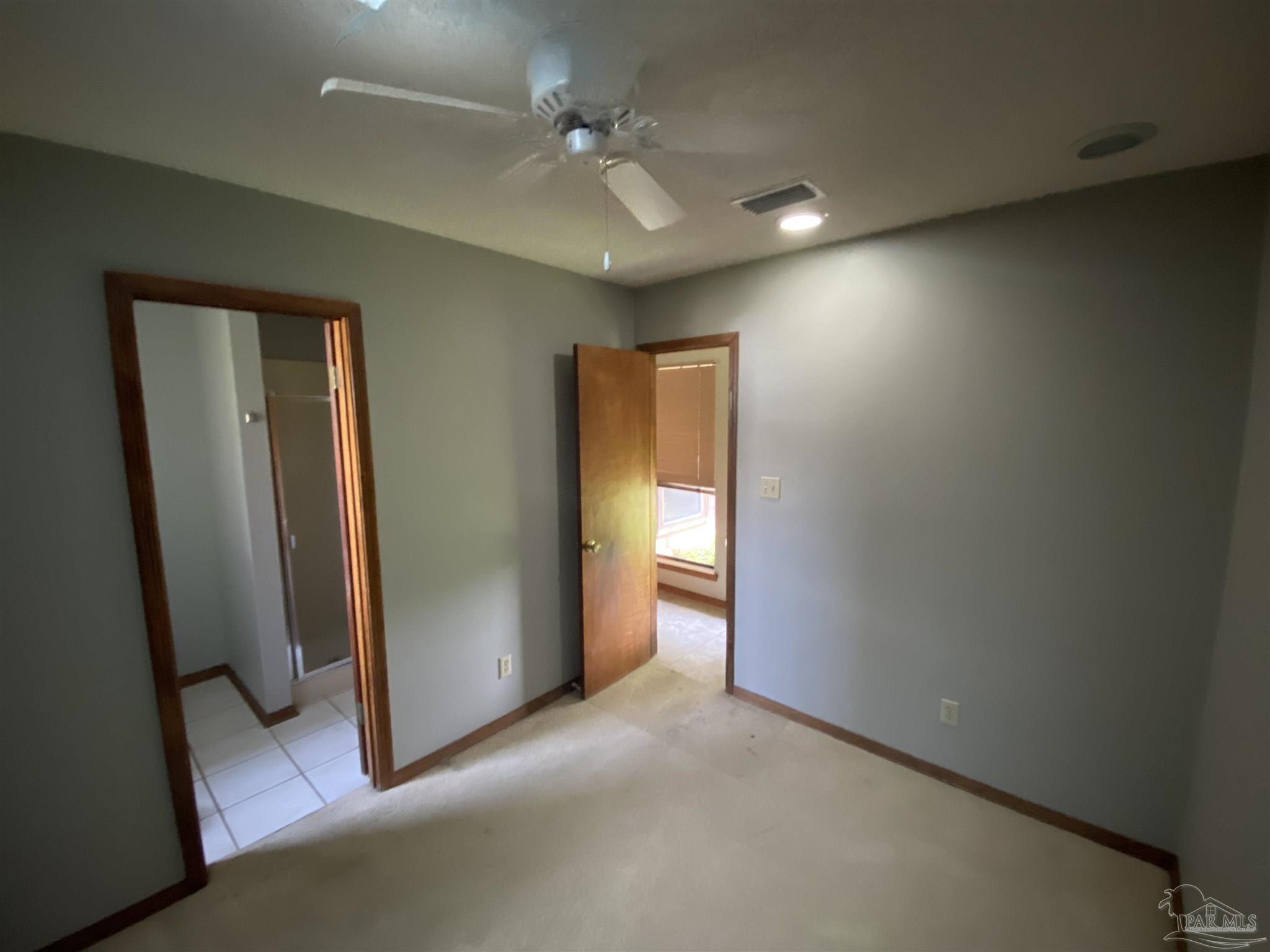 8874 Burning Tree Road Pensacola, FL 32514 - Photo 13 of 22 a view of hallway with a bathroom
