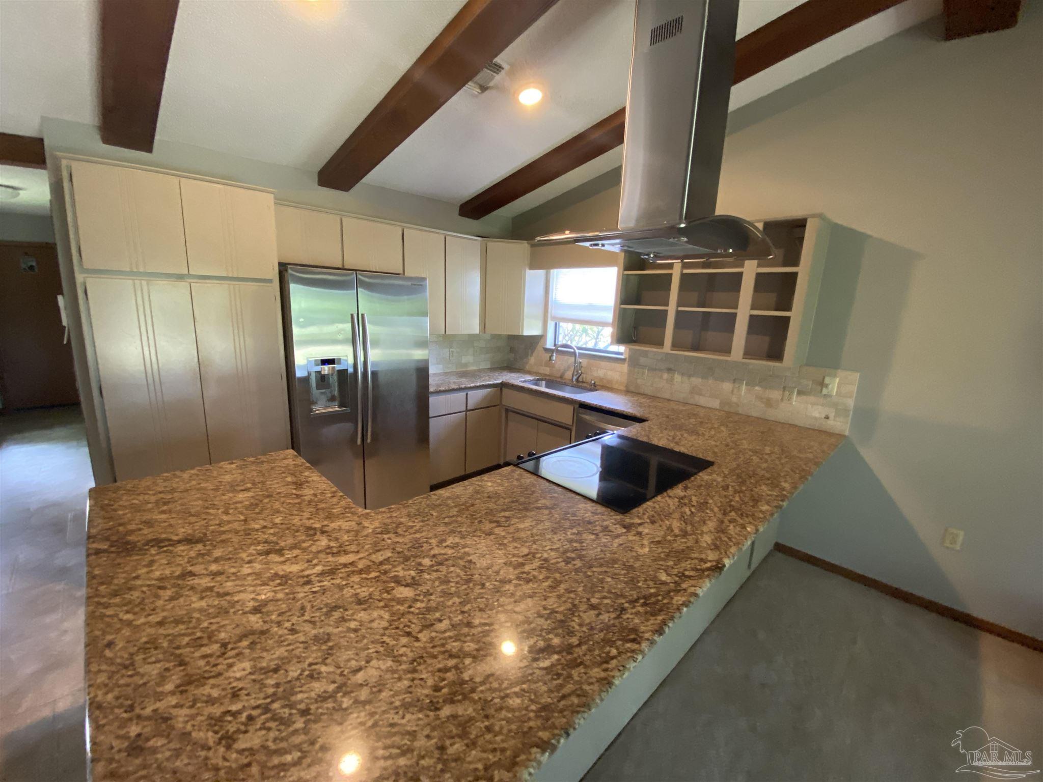 8874 Burning Tree Road Pensacola, FL 32514 - Photo 7 of 22 a kitchen with stainless steel appliances granite countertop a sink a stove and a refrigerator