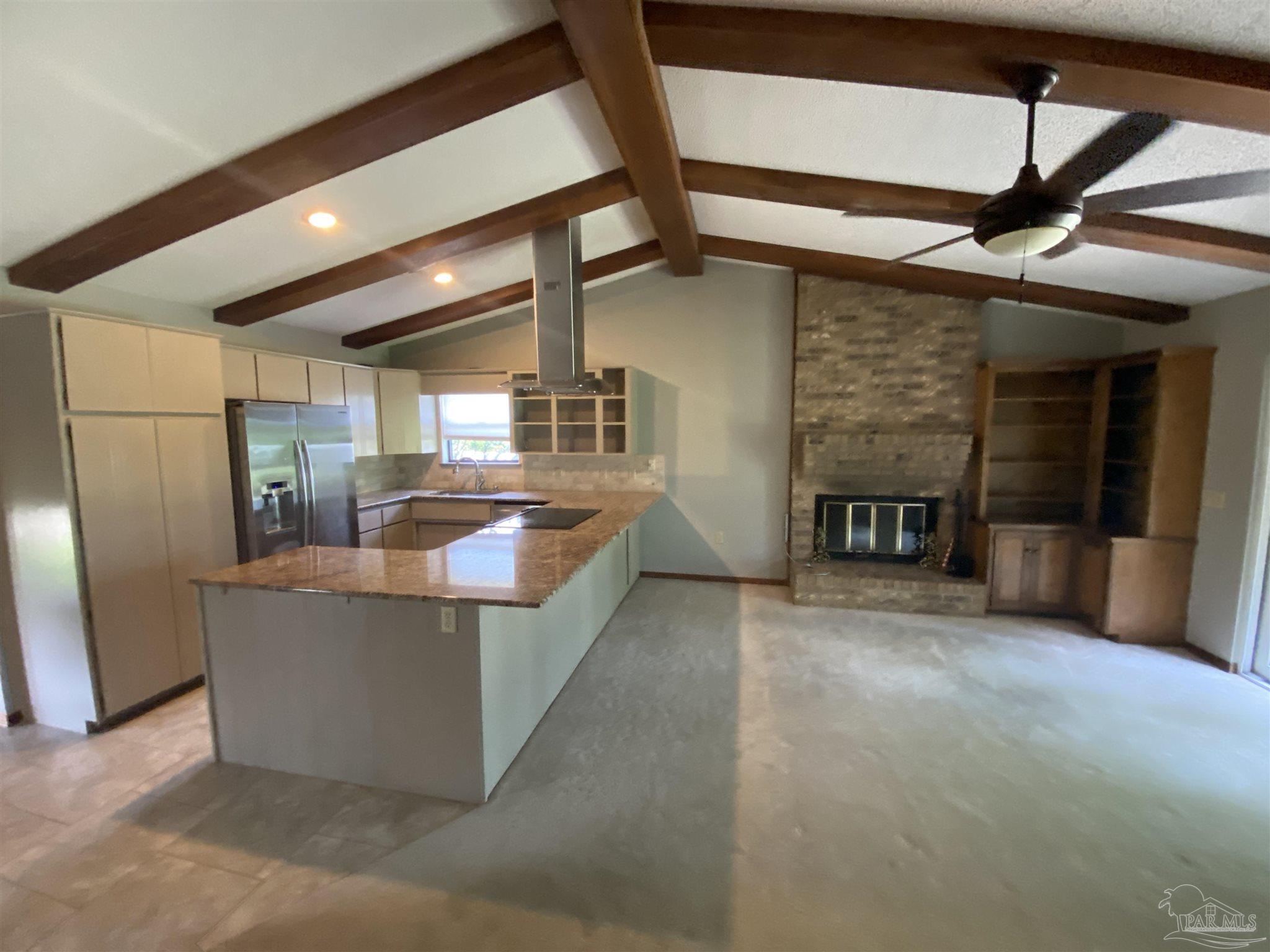 8874 Burning Tree Road Pensacola, FL 32514 - Photo 9 of 22 a living room with furniture and a fireplace