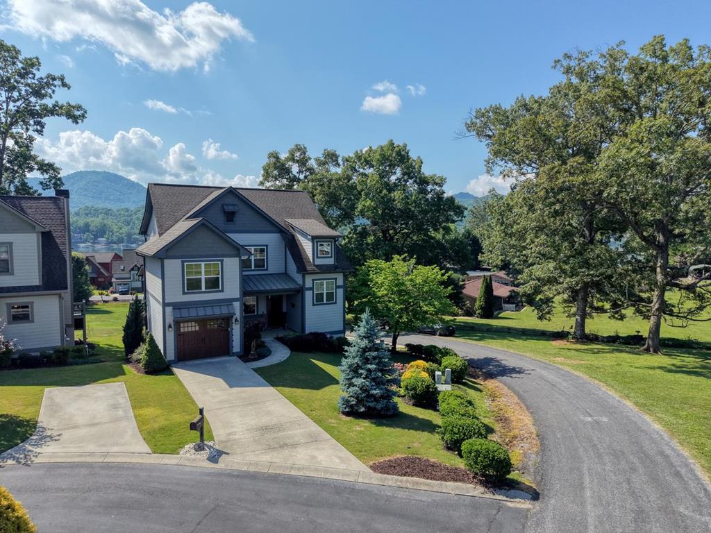 31 Elf School Road Hayesville, NC 28904 - Photo 1 of 59 a front view of a house with a yard and garage