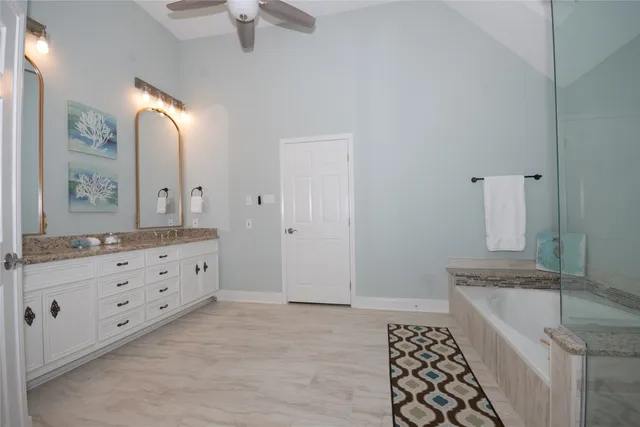 a bathroom with a sink a vanity and a mirror