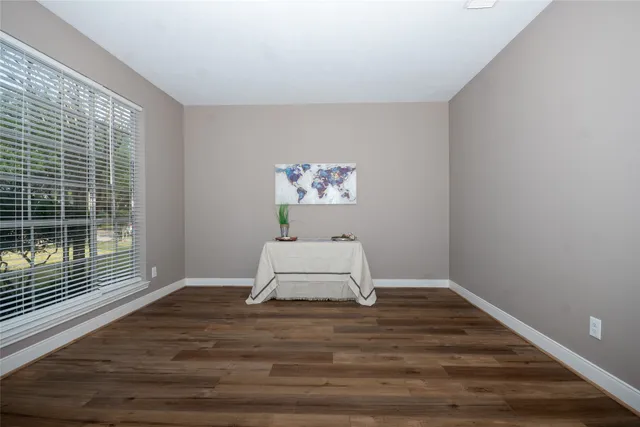 a view of workspace with wooden floor