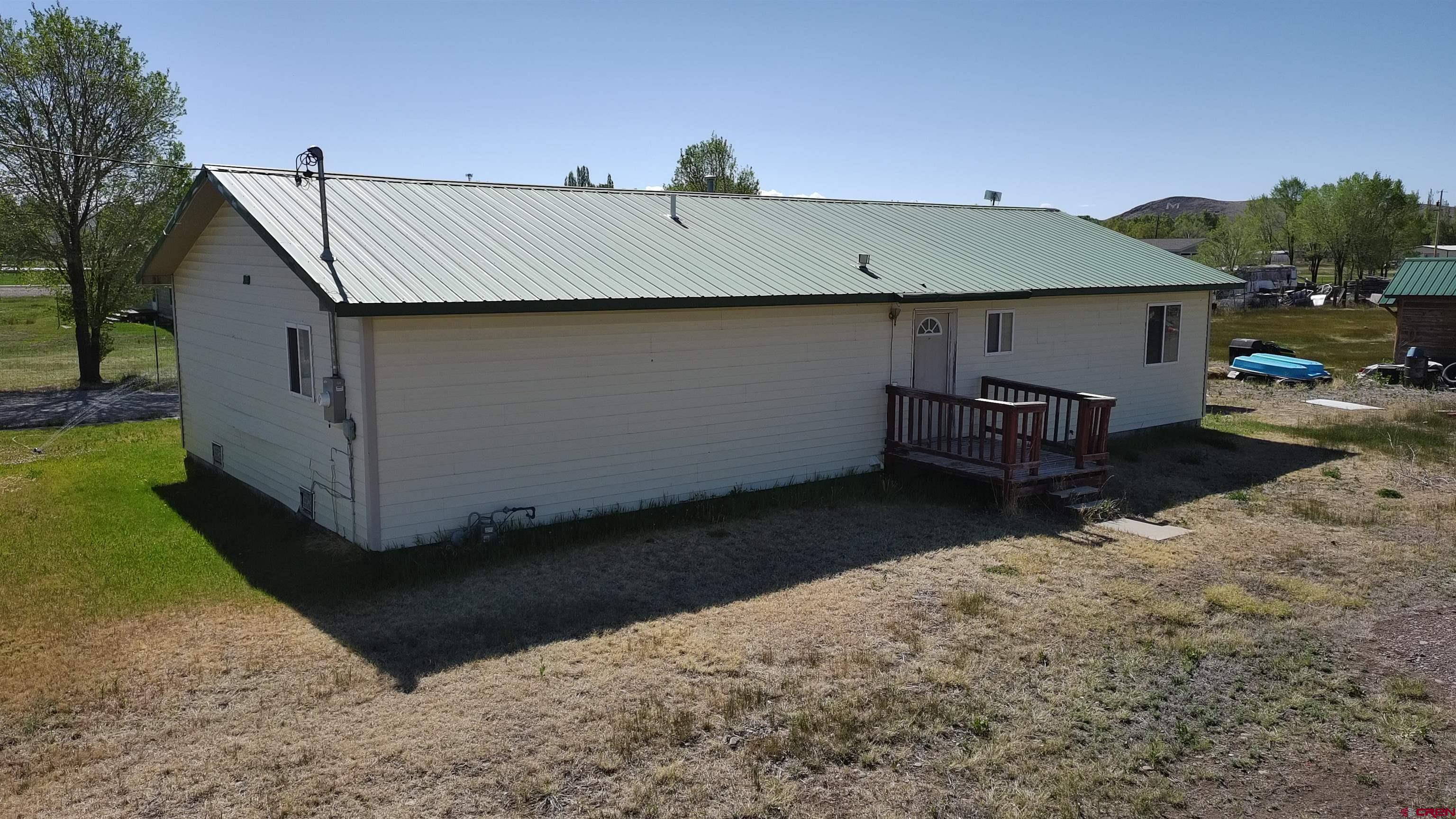 816 Main Street Manassa, CO 81141 - Photo 3 of 23 a view of backyard with seating space