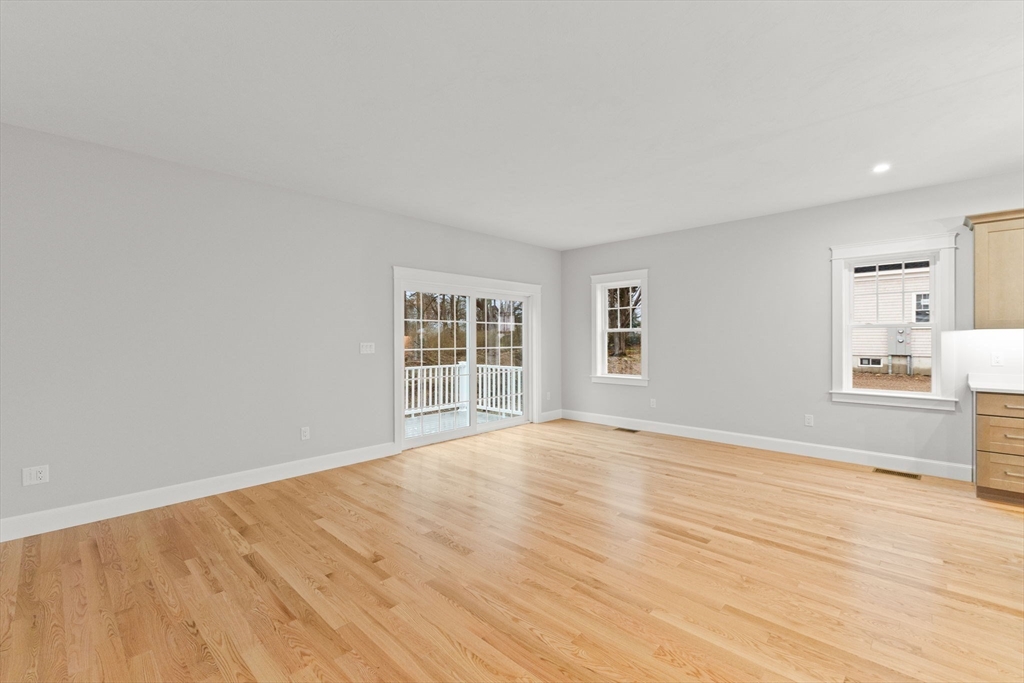 35 Leonard Street, Unit 3 Bridgewater, MA 02324 - Photo 11 of 29 a view of empty room with wooden floor and fan
