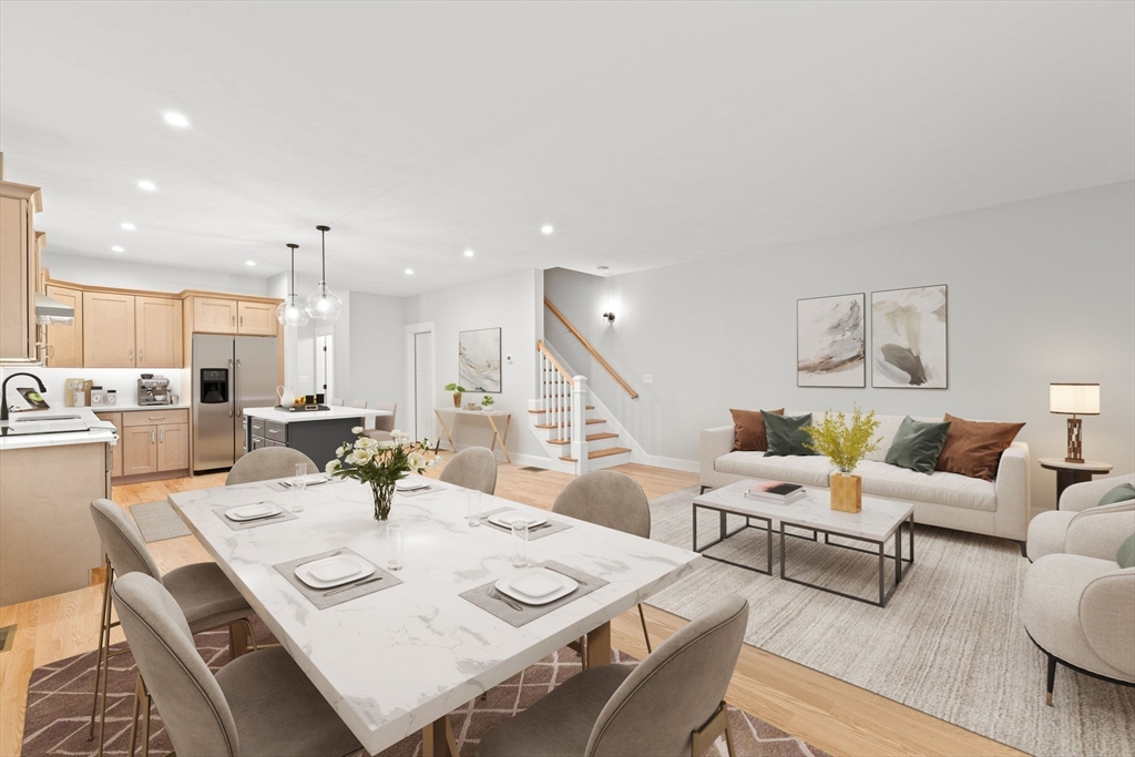 35 Leonard Street, Unit 3 Bridgewater, MA 02324 - Photo 16 of 29 a living room with lots of white furniture and a table
