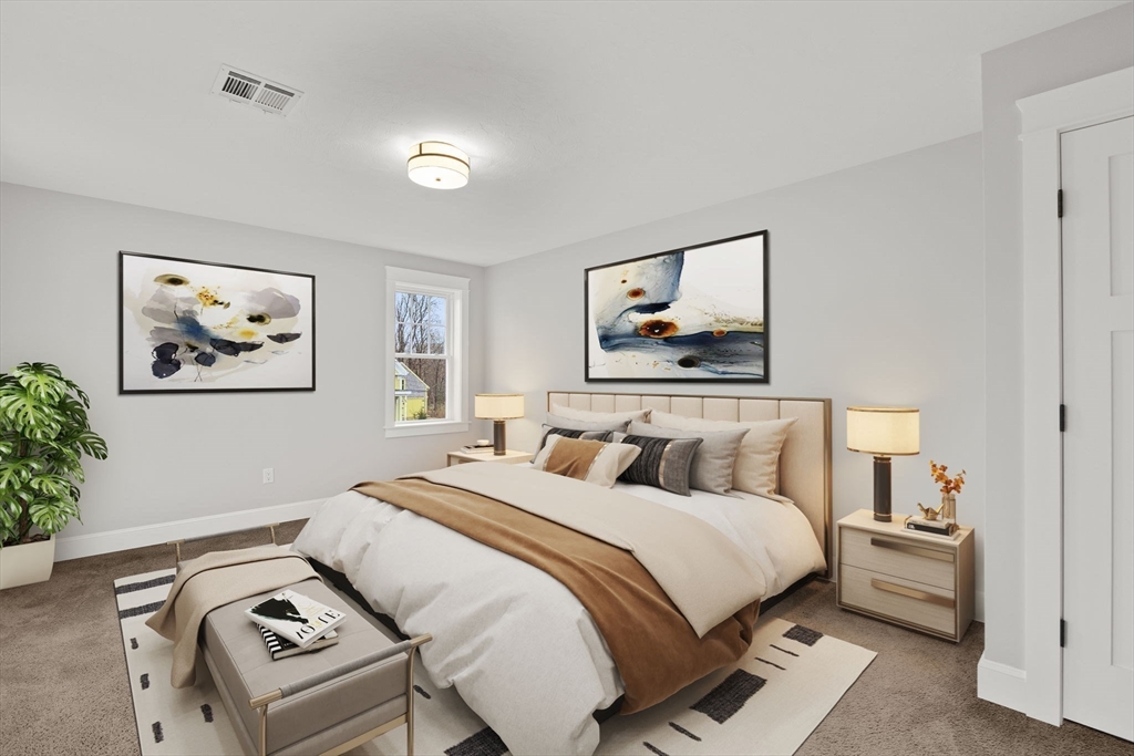 35 Leonard Street, Unit 3 Bridgewater, MA 02324 - Photo 19 of 29 a bedroom with a bed and a painting on the wall