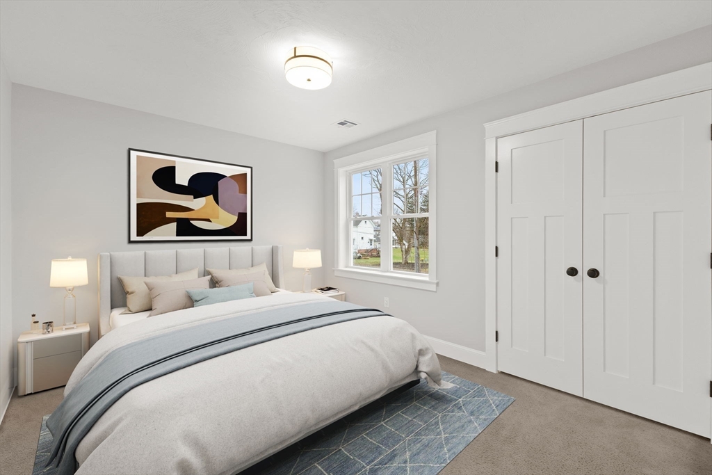 35 Leonard Street, Unit 3 Bridgewater, MA 02324 - Photo 20 of 29 a bedroom with a bed and a painting on the wall