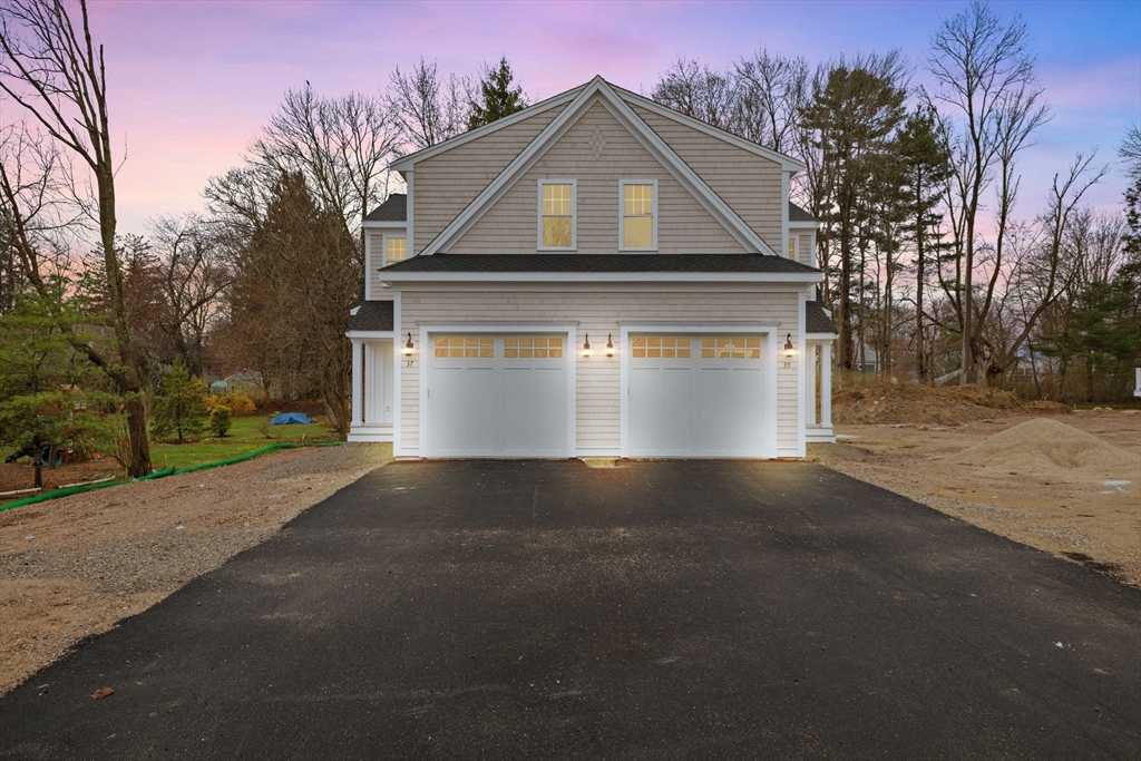 35 Leonard Street, Unit 3 Bridgewater, MA 02324 - Photo 2 of 29 a front view of a house with a yard and garage