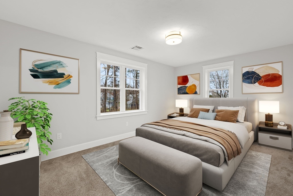 35 Leonard Street, Unit 3 Bridgewater, MA 02324 - Photo 23 of 29 a bedroom with a bed and a painting on the wall