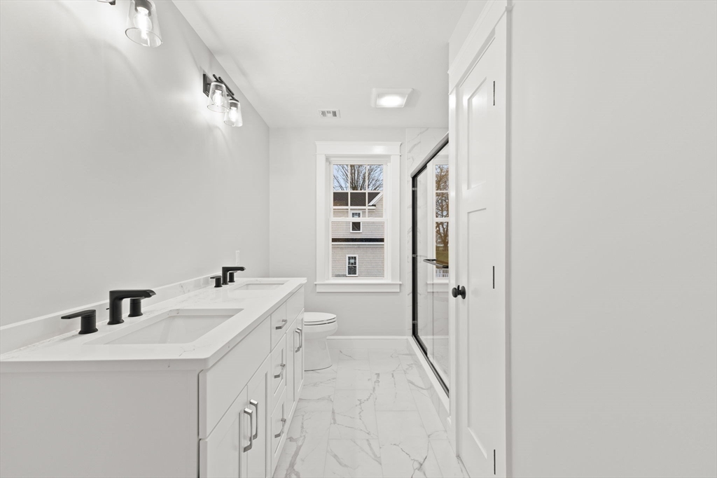 35 Leonard Street, Unit 3 Bridgewater, MA 02324 - Photo 24 of 29 a bathroom with a tub sink and mirror
