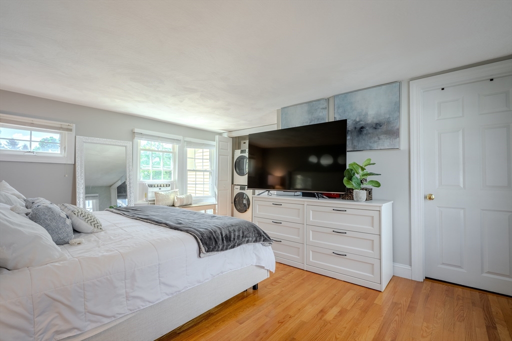 120 Goldsmith Street, Unit 4 Littleton, MA 01460 - Photo 20 of 26 a bedroom with a bed and a flat screen tv