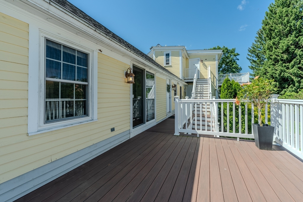 120 Goldsmith Street, Unit 4 Littleton, MA 01460 - Photo 23 of 26 a view of a house with a deck