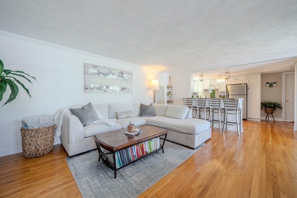 120 Goldsmith Street, Unit 4 Littleton, MA 01460 - Photo 9 of 26 a living room with furniture and wooden floor