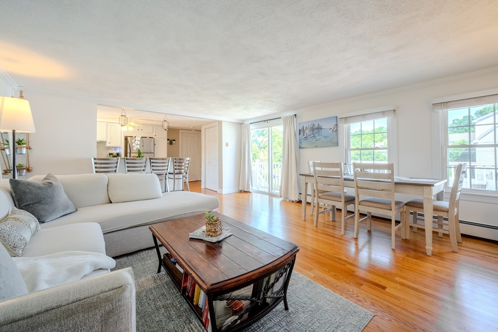120 Goldsmith Street, Unit 4 Littleton, MA 01460 - Photo 10 of 26 a living room with furniture wooden floor and a table