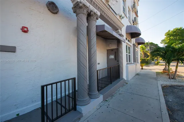 a view of a house with a street
