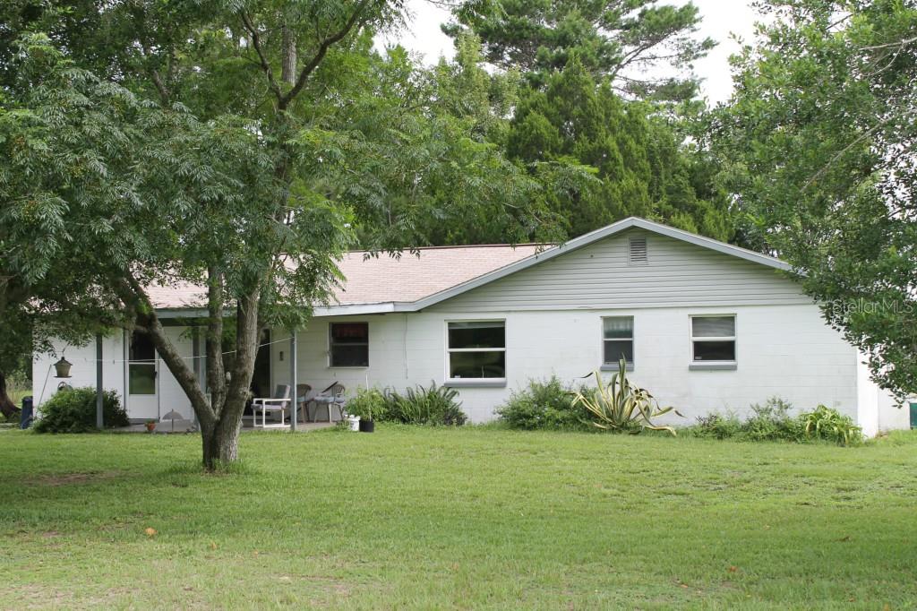 17737 Triple J Ranch Road Spring Hill, FL 34610 - Photo 1 of 1 REAR VIEW AND PATIO