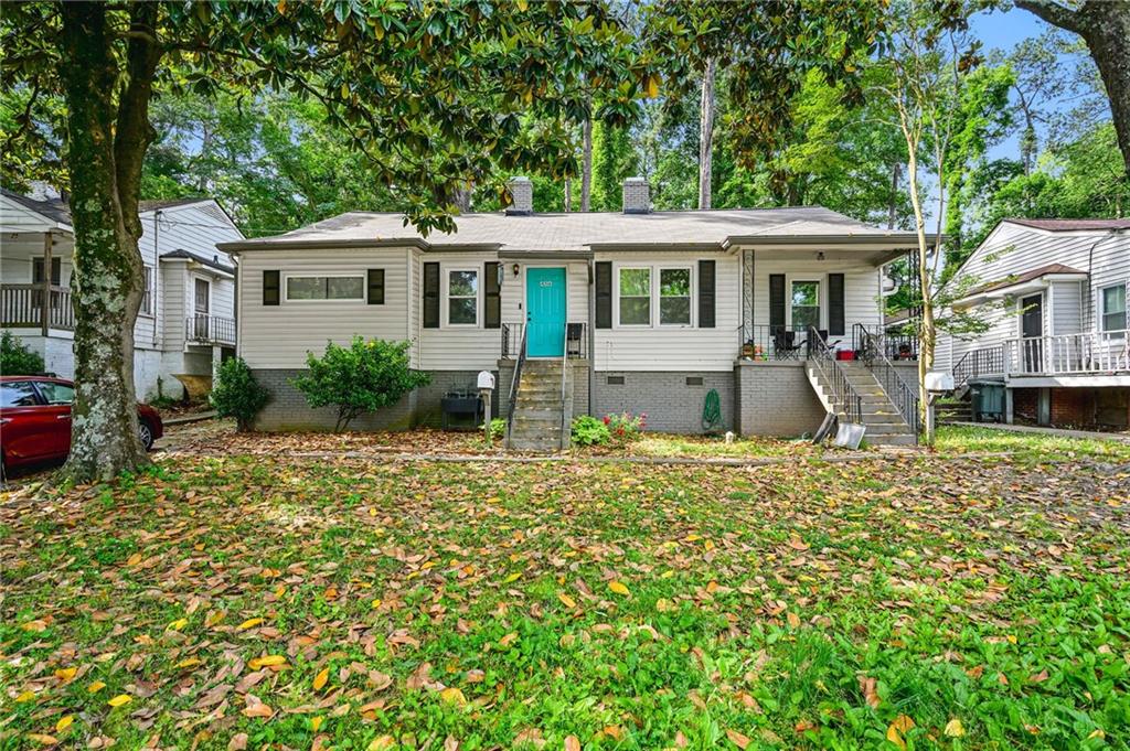 a front view of a house with garden