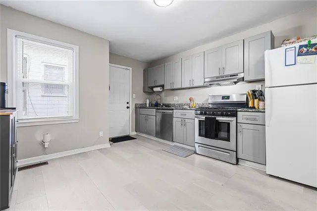 a bedroom with a workspace