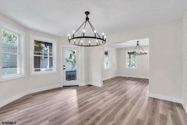 a bathroom with a sink toilet and a mirror