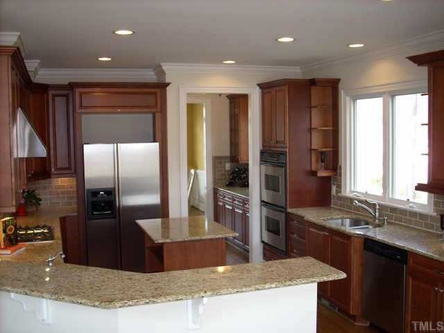 Watch the chef at work from the 4 seat breakfast bar that overlooks this gourmet kitchen that features all stainless appliances including a gas cooktop and dual ovens. Other