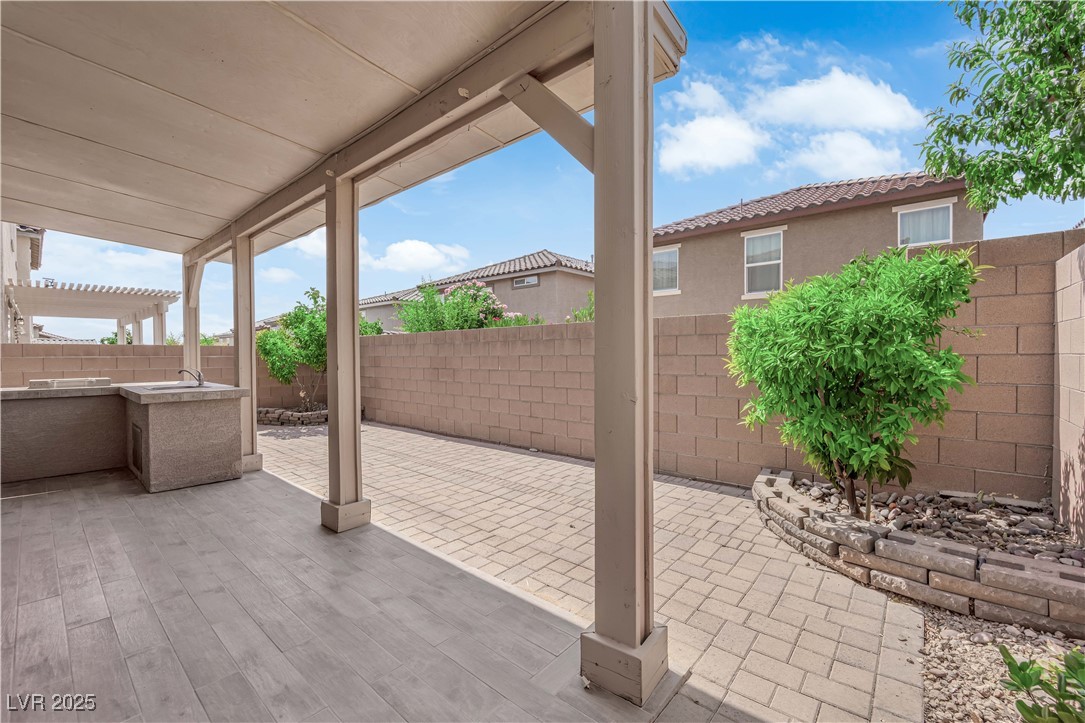 9205 Keystone Ridge Avenue Las Vegas, NV 89148 - Photo 35 of 40 Fenced backyard with a patio area and a sink