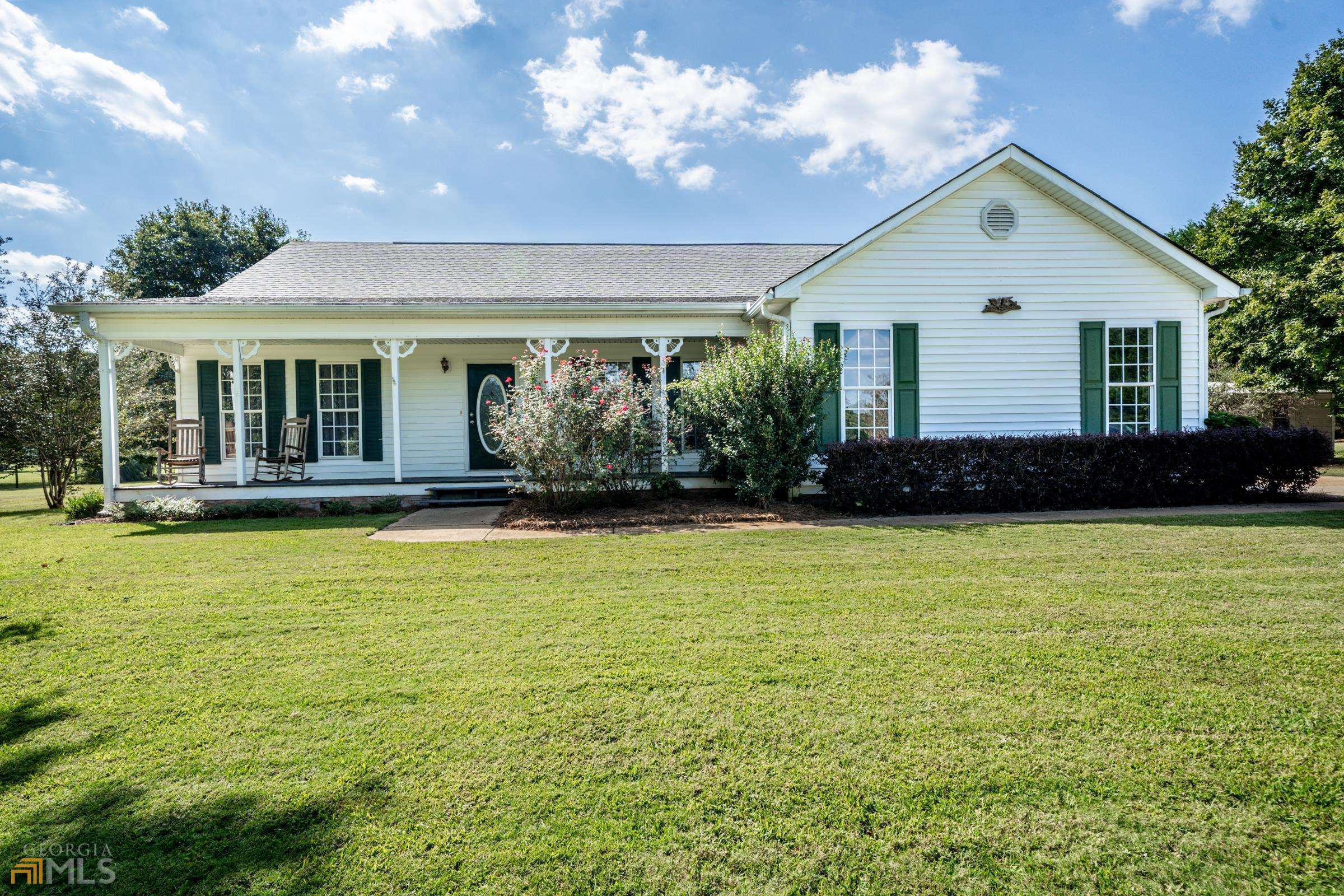 130 Jim McMichael Road Jackson, GA 30233 - Photo 1 of 1 a front view of house with yard and outdoor seating