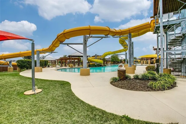 a view of pool with a slide