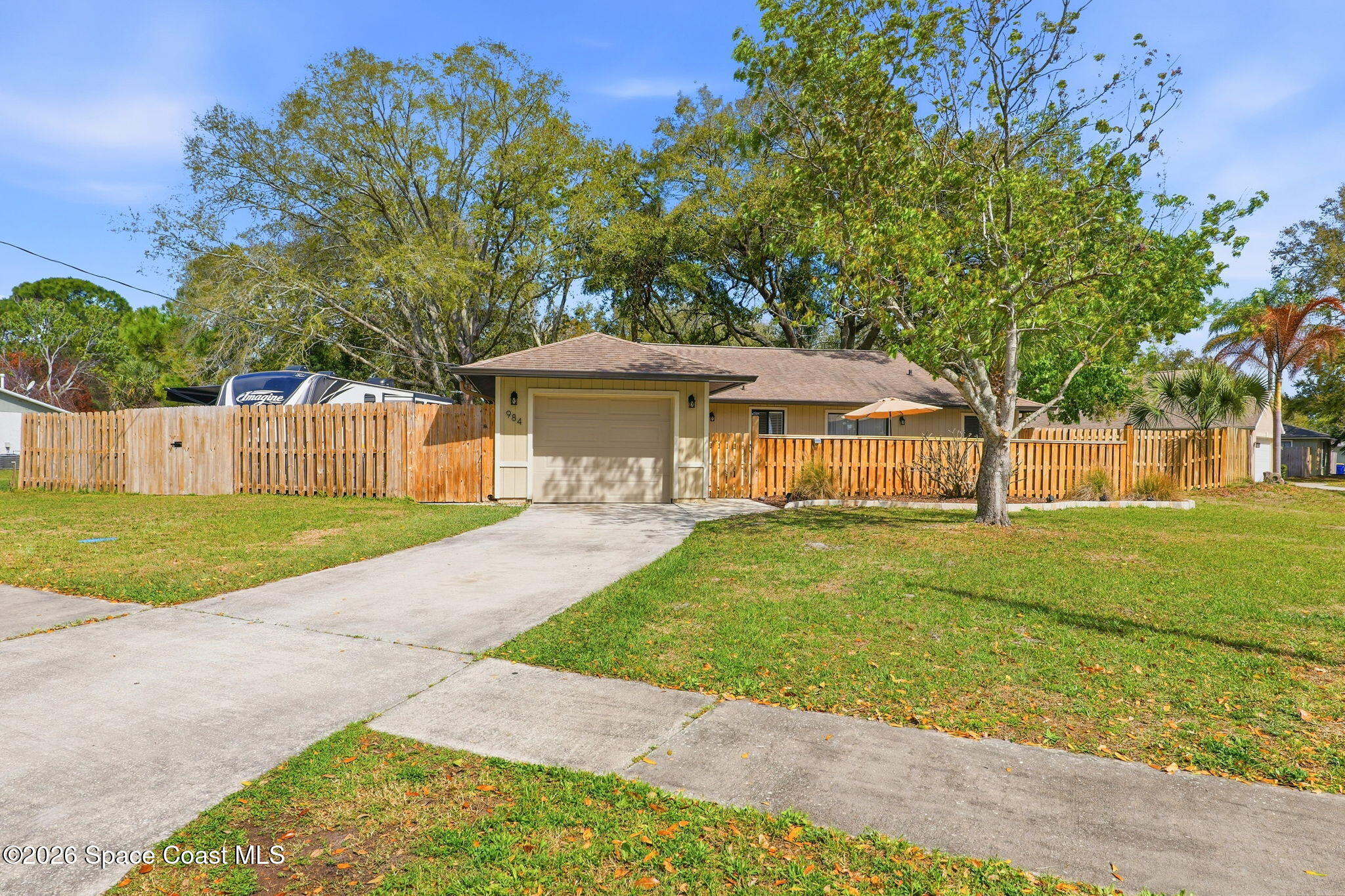984 Bayberry Lane Rockledge, FL 32955 - Photo 1 of 39 a front view of a house with a yard