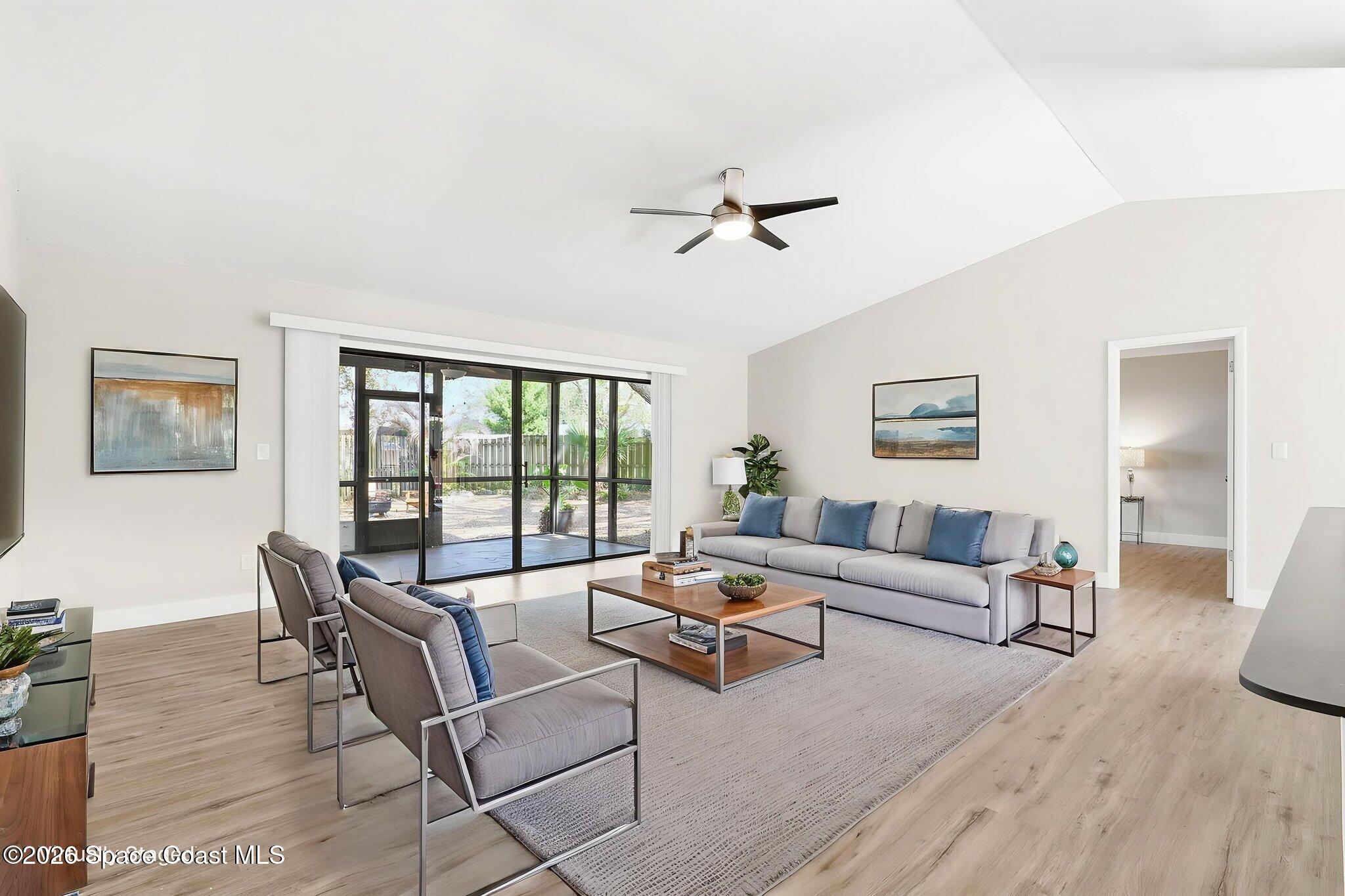 984 Bayberry Lane Rockledge, FL 32955 - Photo 16 of 39 a living room with furniture and a window