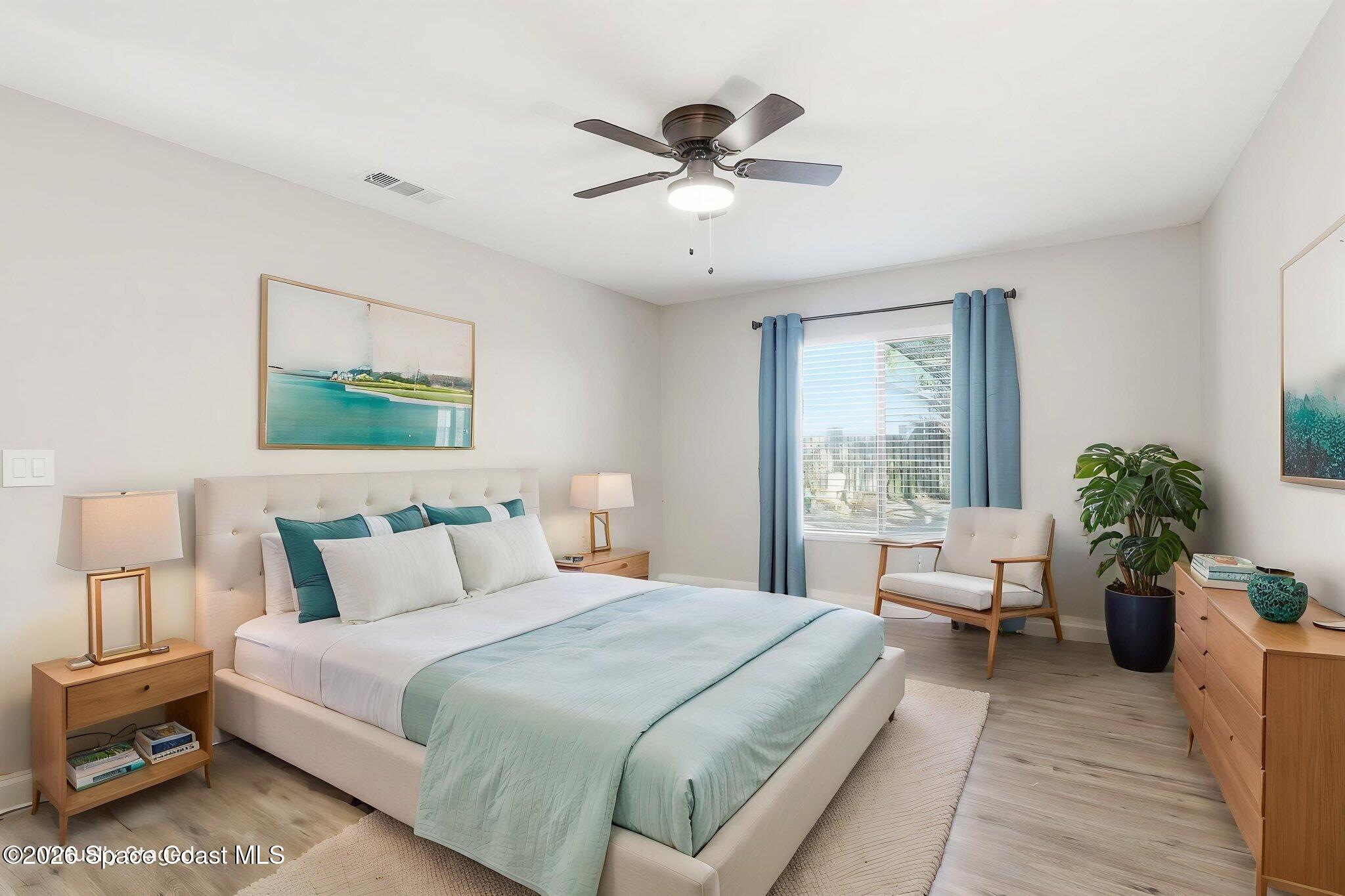 984 Bayberry Lane Rockledge, FL 32955 - Photo 18 of 39 a bedroom with a bed and a large window