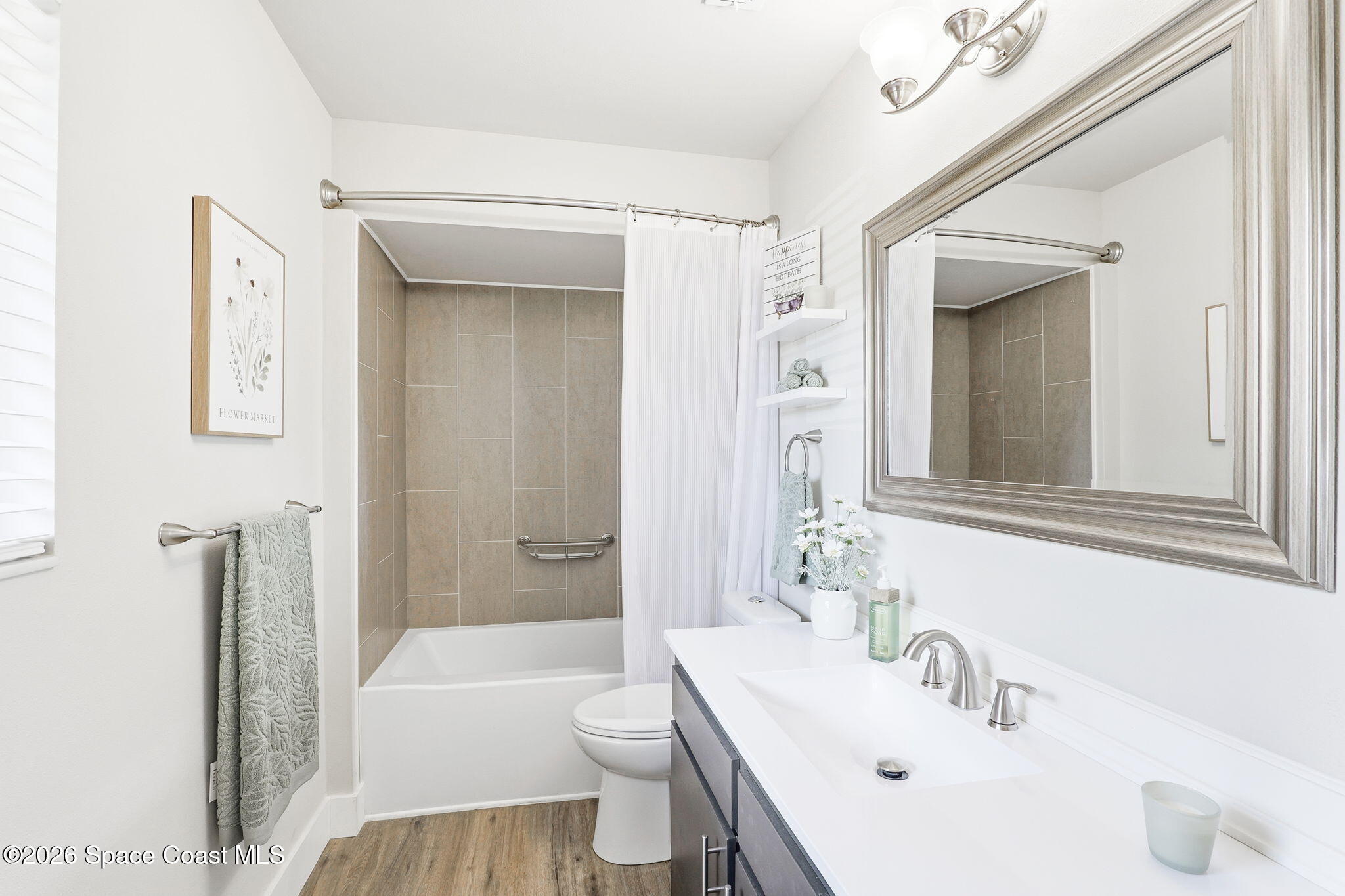 984 Bayberry Lane Rockledge, FL 32955 - Photo 20 of 39 a bathroom with a sink a toilet and shower