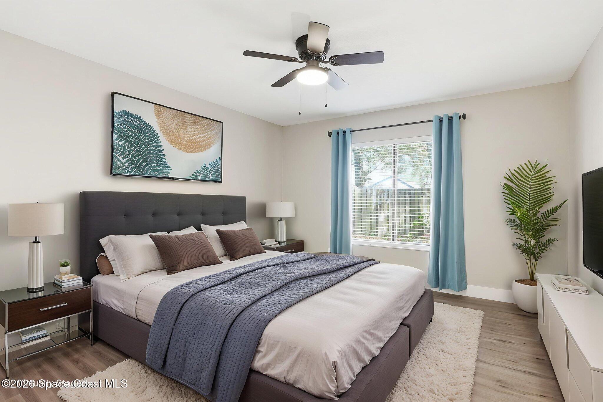 984 Bayberry Lane Rockledge, FL 32955 - Photo 26 of 39 a bedroom with a large bed and a window