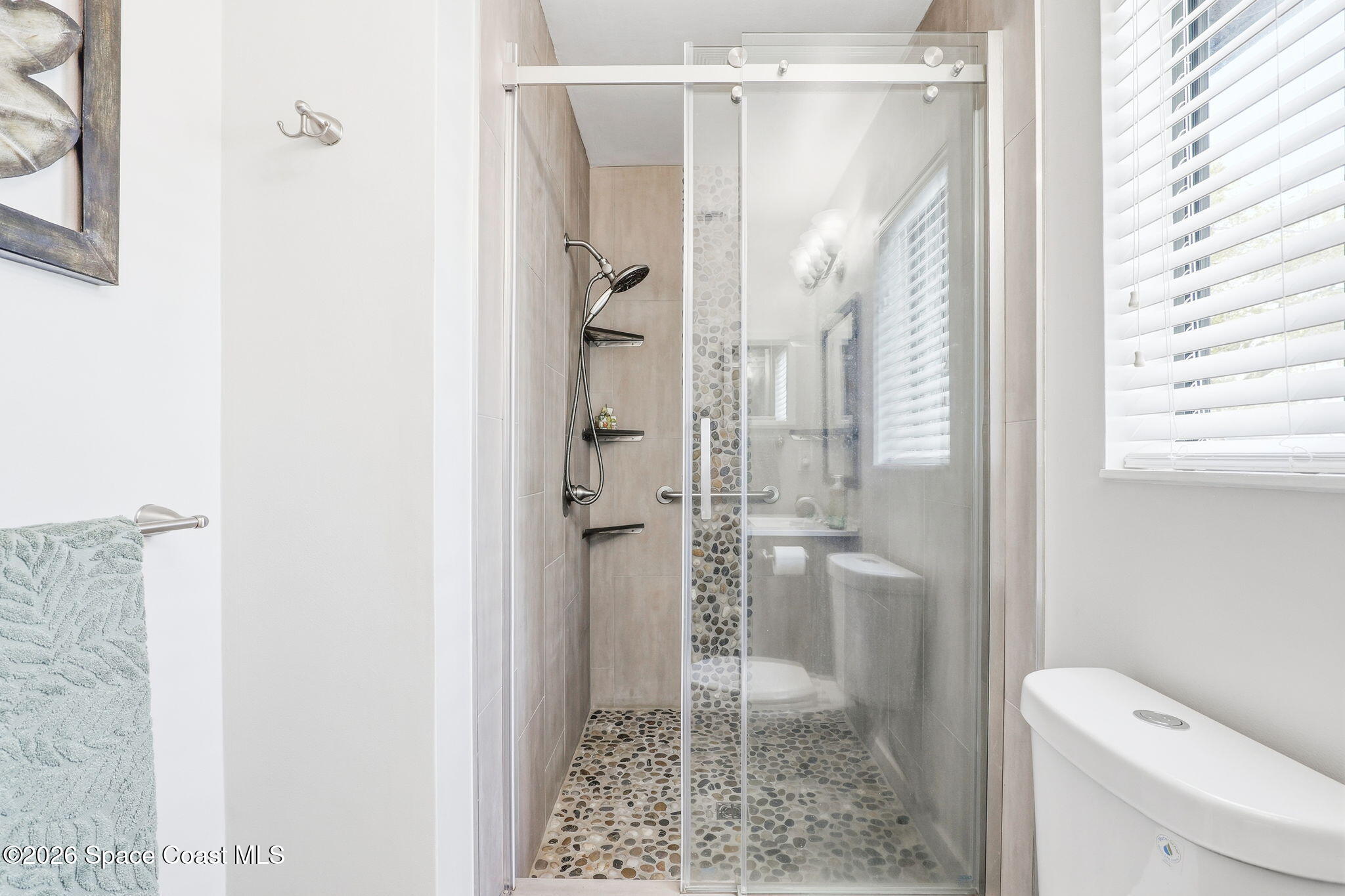 984 Bayberry Lane Rockledge, FL 32955 - Photo 28 of 39 a bathroom with a glass shower door