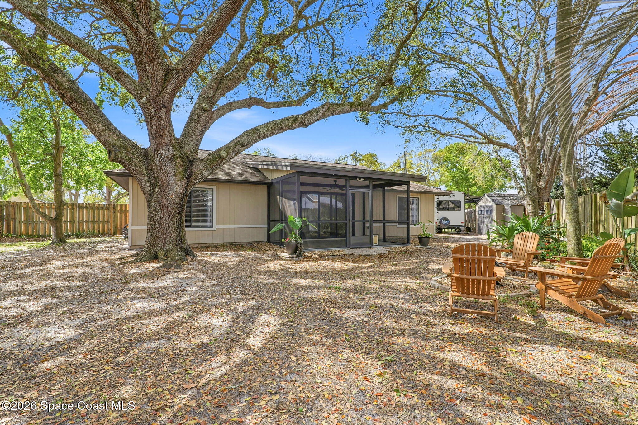 984 Bayberry Lane Rockledge, FL 32955 - Photo 34 of 39 a view of a house with backyard and a tree