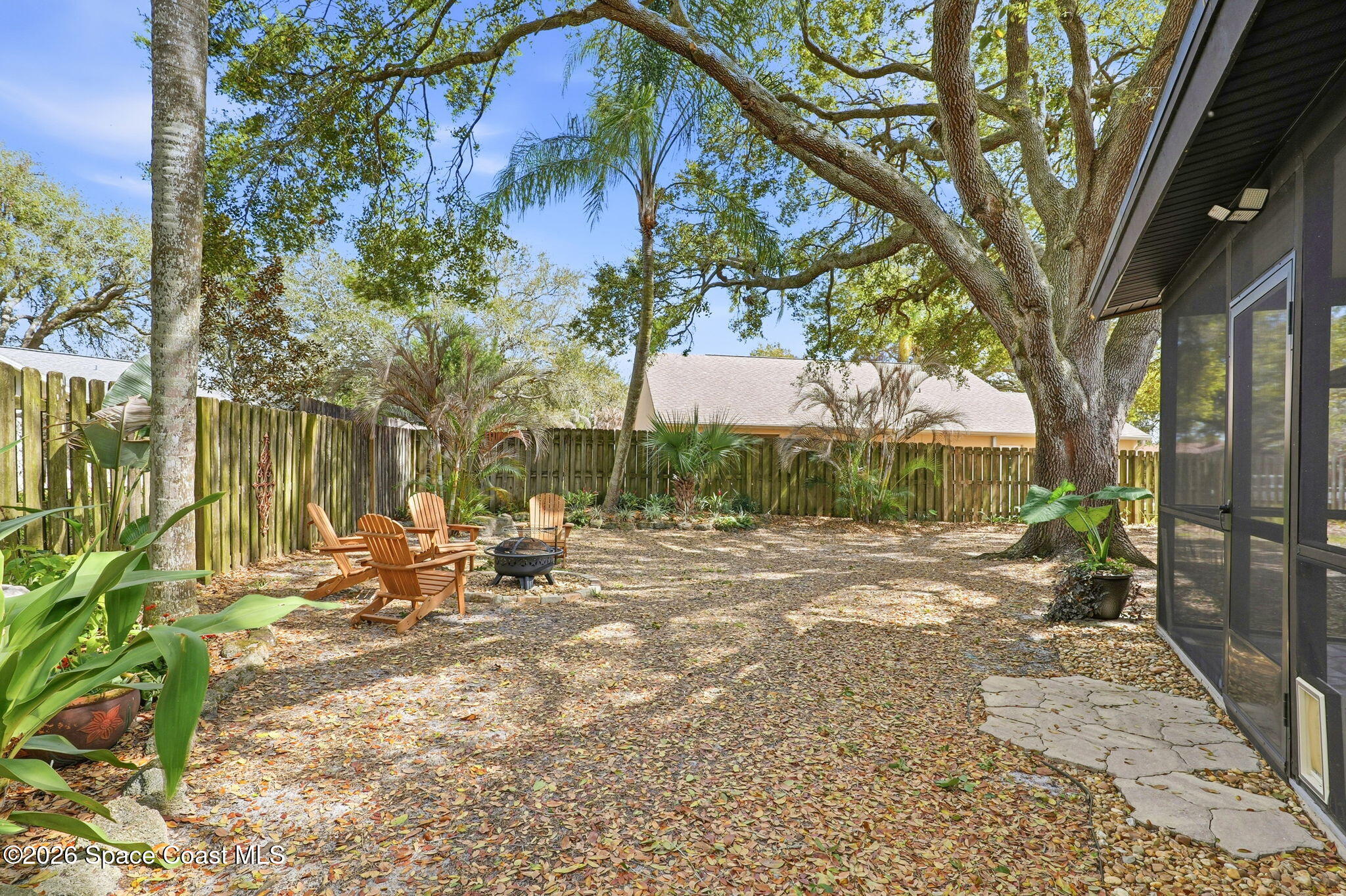 984 Bayberry Lane Rockledge, FL 32955 - Photo 35 of 39 a row of palm trees in front of a house