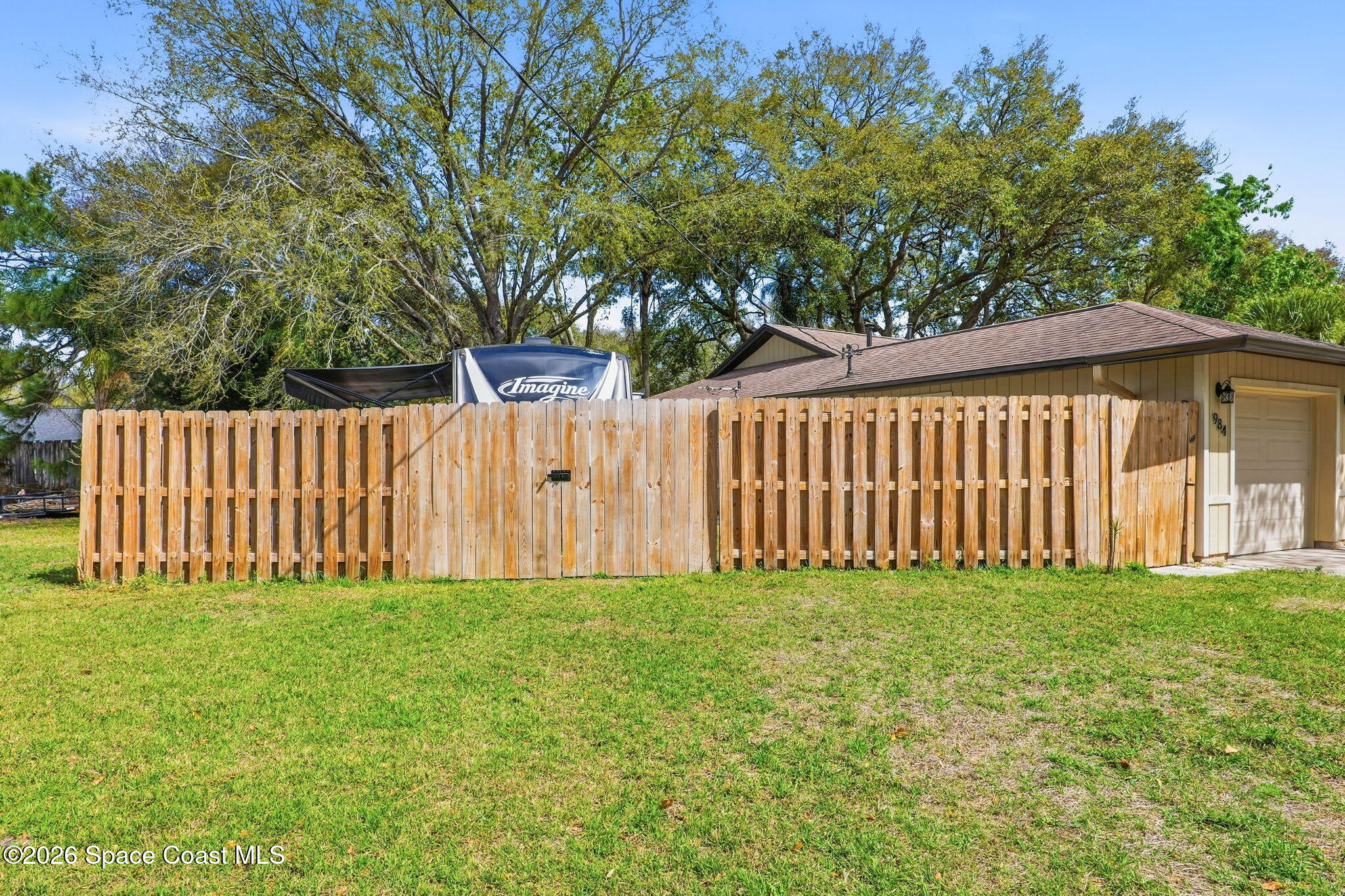 984 Bayberry Lane Rockledge, FL 32955 - Photo 36 of 39 a green field with trees in the background