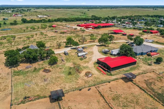 a building with pool and yard
