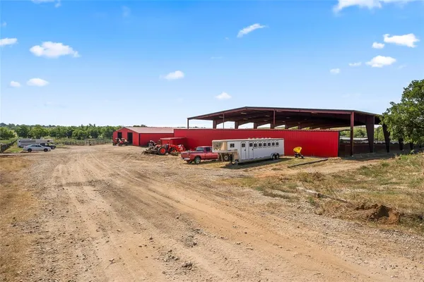 an outdoor space with pool and furniture