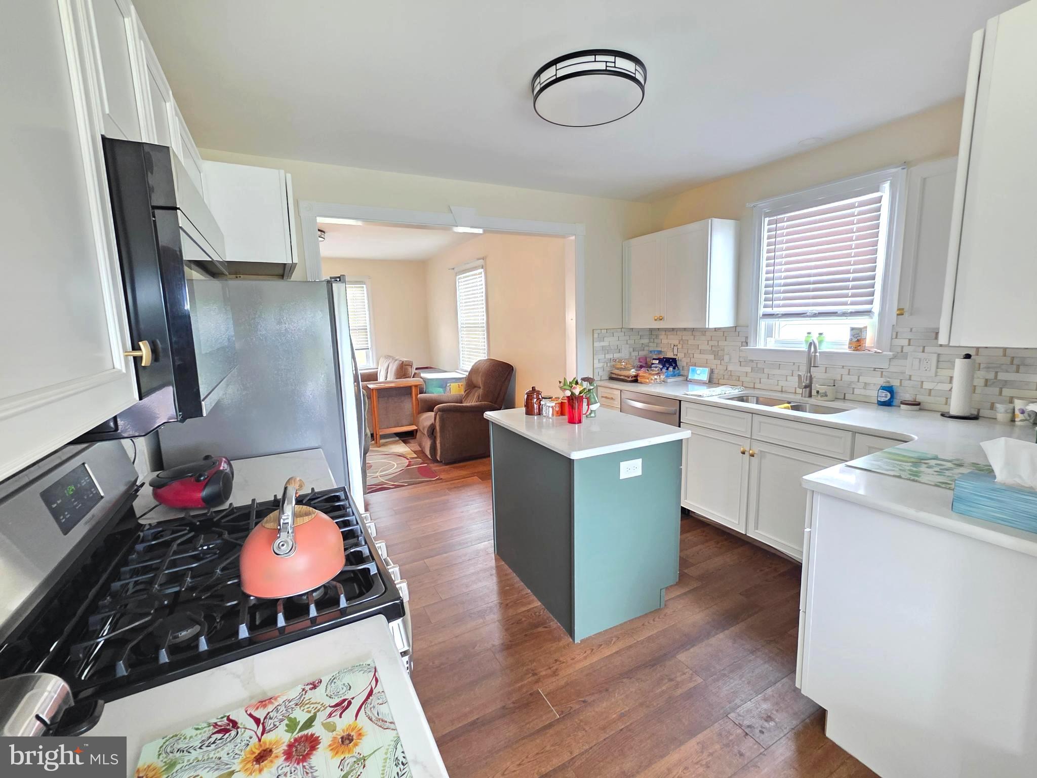 27 George Street Mount Ephraim, NJ 08059 - Photo 10 of 27 a kitchen that has a lot of cabinets a sink and a stove in it